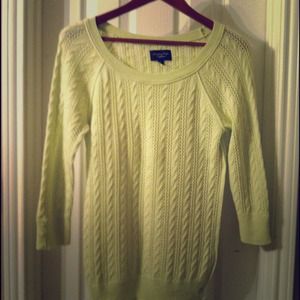 Lime green sweater .