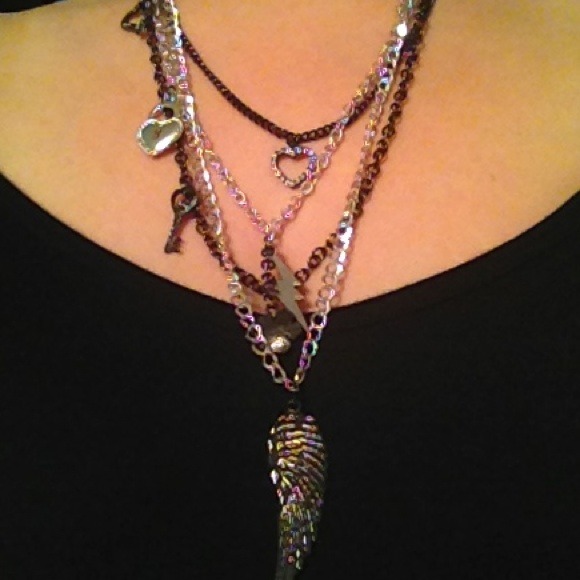 Long multilayer necklace with different charms. - Picture 1 of 2