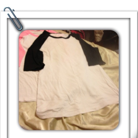 Two 3/4 length sleeved shirts.