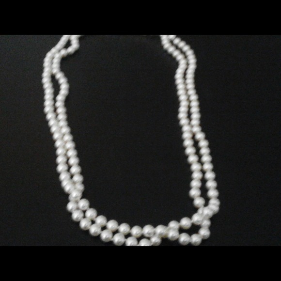 Long strand of faux pearls