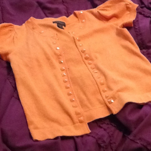 35. Orange embellished cardigan