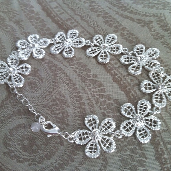 Silver Plated flower bracelet with rhinestones.