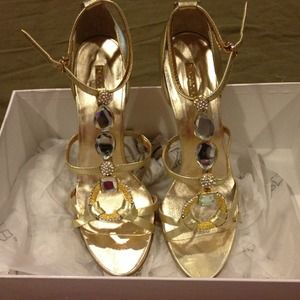 Gold open toe shoes