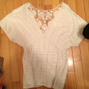 White and silver short sleeve shirt.