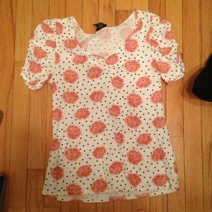 Short sleeve white shirt with navy polka dots.