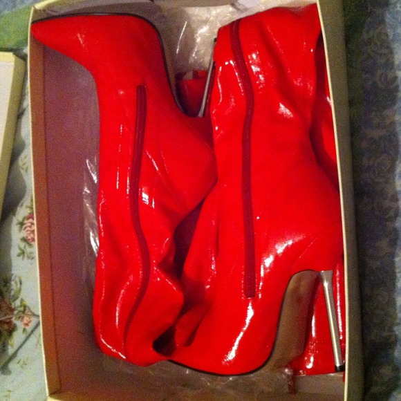 red thigh highs with a 4 inch heel pointed toed