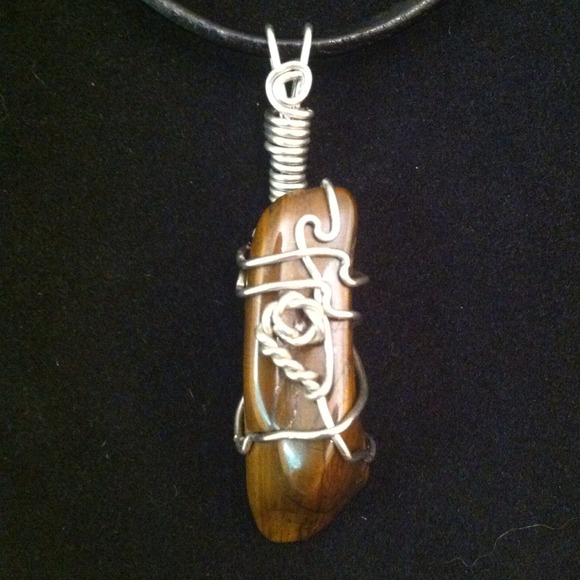 Silver wire and red tiger eye gemstone pendant.