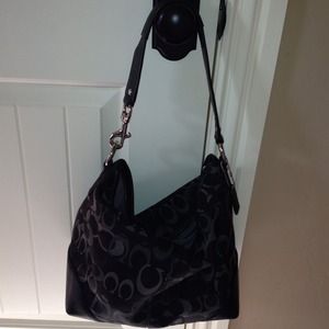 Black and gray Coach monogram handbag
