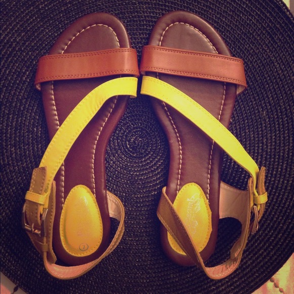 Brown and yellow strapped sandals.