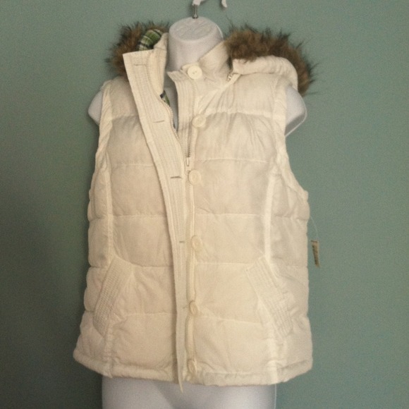White vest with removable hood.