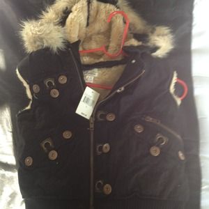 Large  zip vest with hood new still has tags