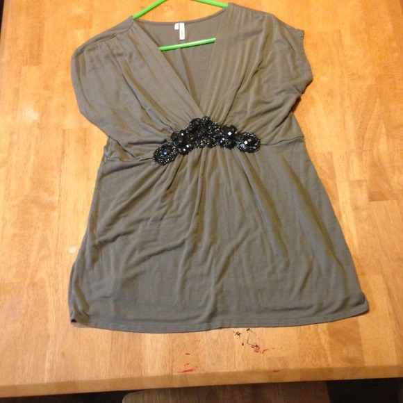 Grey top with black beaded accents.