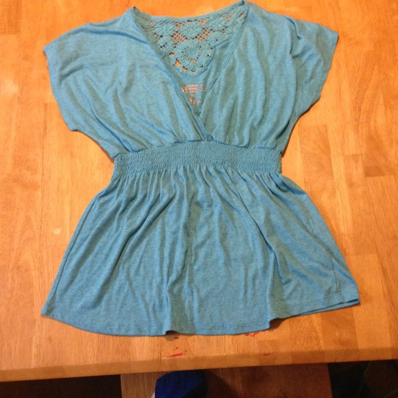 Blue Maurice's top with crochet details on back.