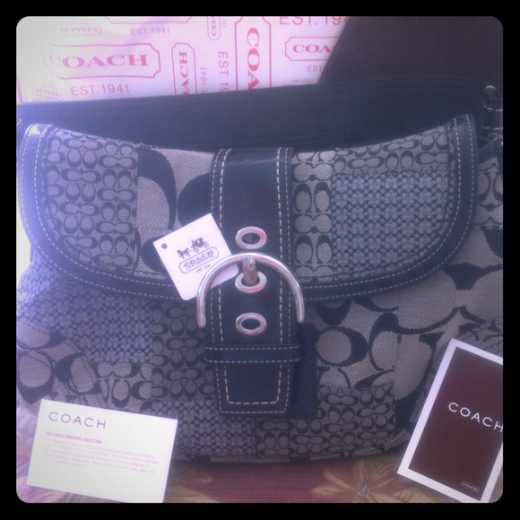 SOLD Coach Handbag black C's and Purple lining.
