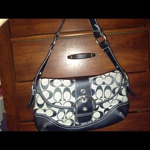 Black and grey real coach purse.