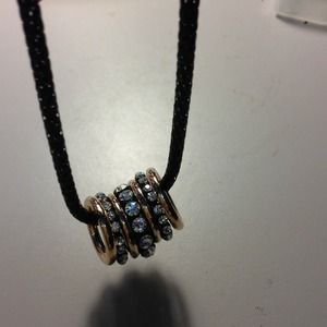 7 rings necklace with 3 full Cz rings