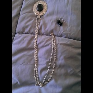 Long sliver necklace with matching earrings.
