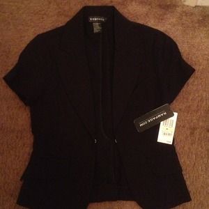 Black short sleeve suit jacket.