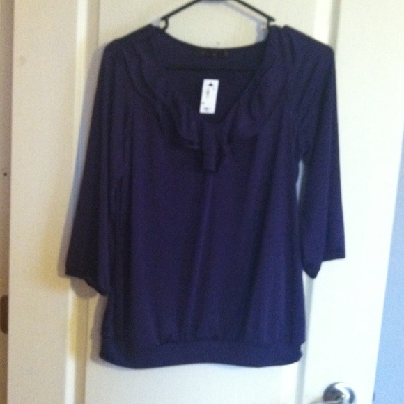 Limited three quarter length ruffle front top