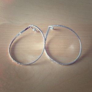 Fun silver-tone hoops with stud backing.