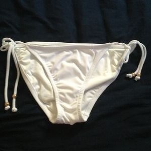 TRADED: White bikini bottoms.