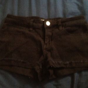 Black stretchy jean shorts.