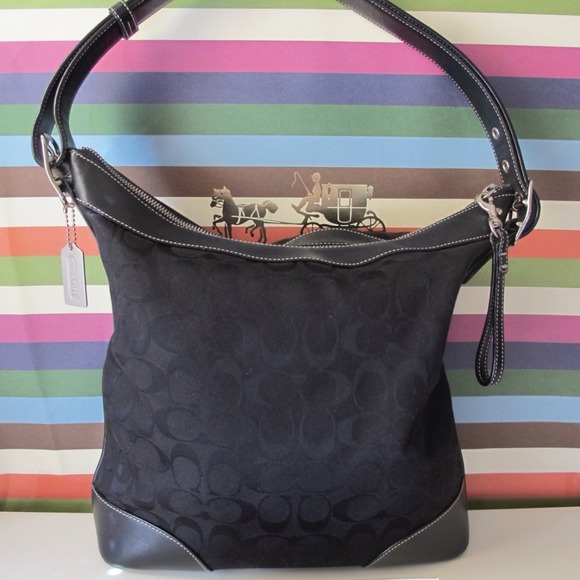 Sold out- Authentic Coach Signature handbag. Used.