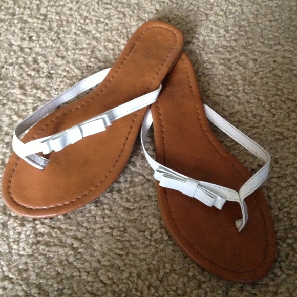 Brown and white flip flips