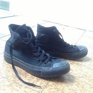 Converse chucks black hi-tops high tops.