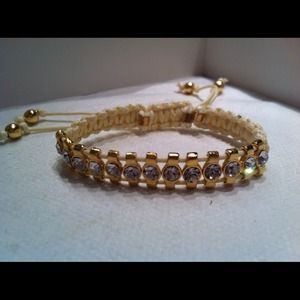 Rhinestone bracelet on ivory string.