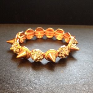 Rose gold tone spike and crystal bracelet