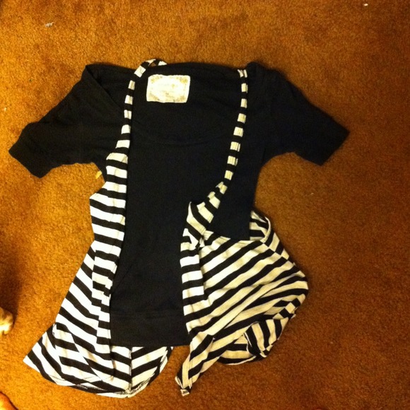 Black shirt and black n white over thing