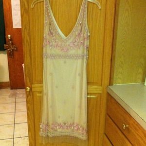 Nude/Blush colored gown.