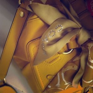 Brand new yellow coach purse.!