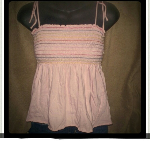 Baby doll top, has spaghetti straps that tie