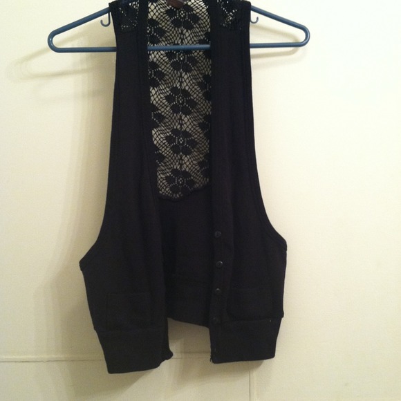 A SoSik vest  with lace down the back .  Worn once