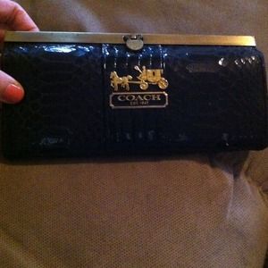Black and gold faux coach wallet