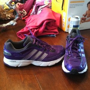 Trendy purple Adidas running shoes.