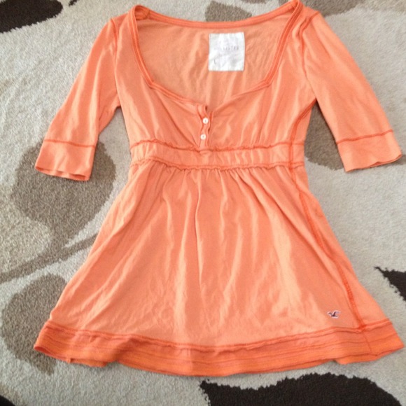 Orange hollister shirt.