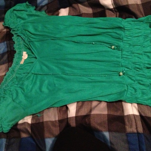 Sold in bundle. Green ruffled top