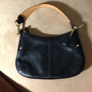 Mini black leather coach bag.