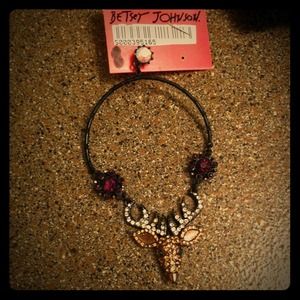 Dangling crystal earrings by Betsey Johnson