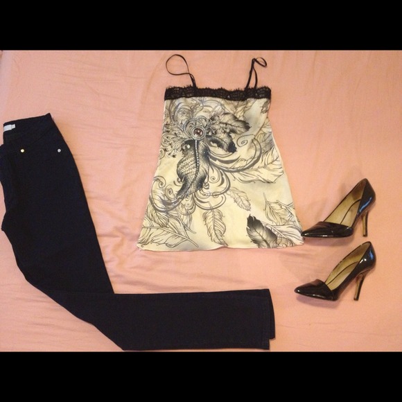Cute silk like top with crystal accents.