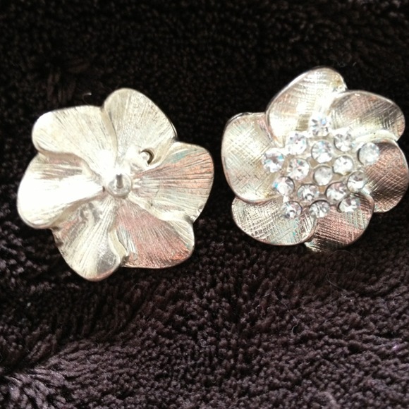 Silver embellished flower earrings.