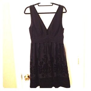 Black party dress from H&M with deep plunge