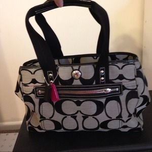Black, gray, and hot pink coach bag