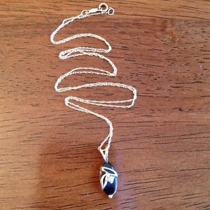 10k gold necklace with black precious stone