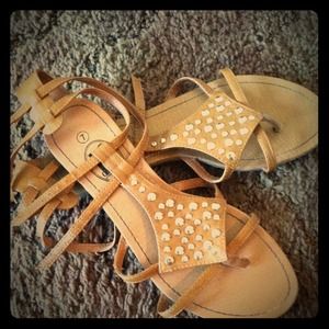 Brown straps gladiator sandals w/ silver detail.