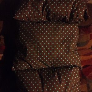 Three brown and mint green poka dot pillows