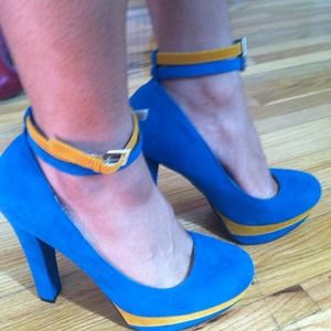 Turquoise and mustard shoes.